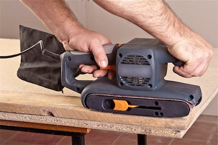 simsearch:400-04856931,k - A man working with electrical sanding machine, close up on tool, hands and sparks, real situation picture Photographie de stock - Aubaine LD & Abonnement, Code: 400-04339232