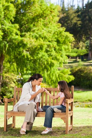 portrait of family on park bench - Cute girl with her mother in the park Stock Photo - Budget Royalty-Free & Subscription, Code: 400-04339540