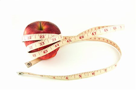 Red apple with tape isolated on white (good shape and good health concept) Photographie de stock - Aubaine LD & Abonnement, Code: 400-04339579