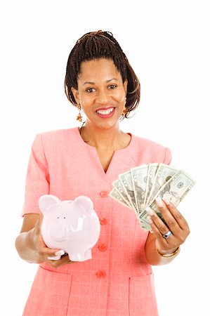 Beautiful african-american woman saving money in her piggy bank.  Isolated on white. Stock Photo - Budget Royalty-Free & Subscription, Code: 400-04339632