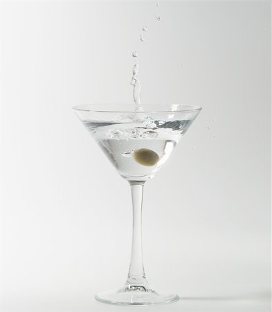 simsearch:400-06911038,k - martini cocktail splashing into glass on white background Stock Photo - Budget Royalty-Free & Subscription, Code: 400-04330185
