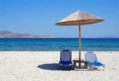 simsearch:400-06914796,k - Greece. Kos island. Tigaki beach.Two chairs and umbrella on the white sand beach Stock Photo - Budget Royalty-Free & Subscription, Code: 400-04330583