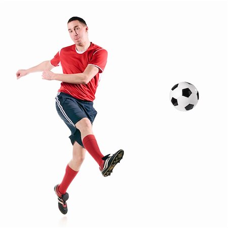 football flying - soccer player strongly hits the ball, isolated on white Stock Photo - Budget Royalty-Free & Subscription, Code: 400-04330595