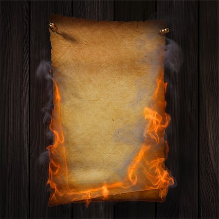 paper tore - Burning old yellow paper on brown wood texture. Stock Photo - Budget Royalty-Free & Subscription, Code: 400-04331054