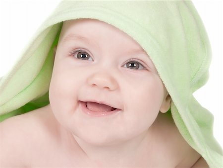 Cute smiling baby with a green towel on a white Foto de stock - Super Valor sin royalties y Suscripción, Código: 400-04331082