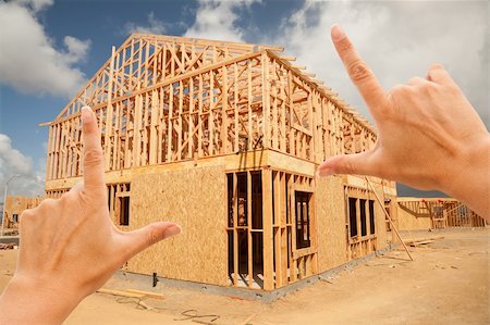 simsearch:400-05344387,k - Female Hands Framing New Home Frame on Construction Site. Stock Photo - Budget Royalty-Free & Subscription, Code: 400-04331134