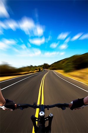 Bicycle rider with high speed view on the road Stock Photo - Budget Royalty-Free & Subscription, Code: 400-04331309