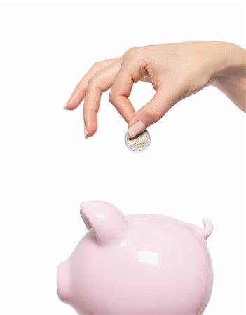 simsearch:400-04995456,k - Hand putting money into the piggy bank isolated on white Stockbilder - Microstock & Abonnement, Bildnummer: 400-04331514