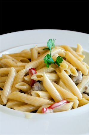 simsearch:400-04055000,k - Penne pasta with mushrooms, served on a white plate Photographie de stock - Aubaine LD & Abonnement, Code: 400-04331729