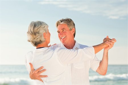 Mature couple dancing on the beach Stock Photo - Budget Royalty-Free & Subscription, Code: 400-04332081