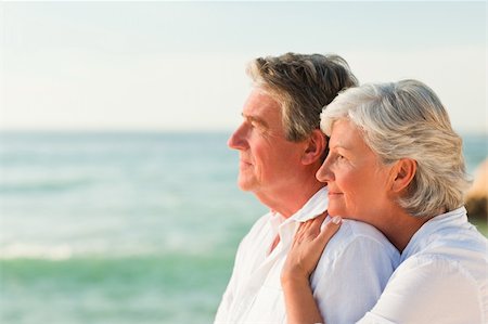 elderly women swimsuit - Woman hugging her husband at the beach Stock Photo - Budget Royalty-Free & Subscription, Code: 400-04332113