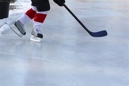 Legs of young child playing outdoor pond hockey Foto de stock - Super Valor sin royalties y Suscripción, Código: 400-04332259