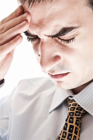 simsearch:400-05363701,k - Isolarted business man expressing headache Stock Photo - Budget Royalty-Free & Subscription, Code: 400-04332848