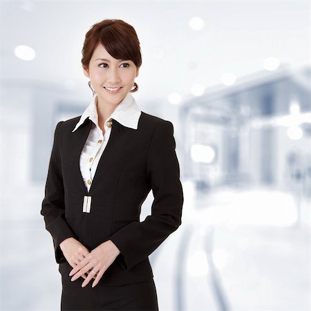 Successful young executive woman smiling, closeup portrait in office. Stock Photo - Budget Royalty-Free & Subscription, Code: 400-04333270