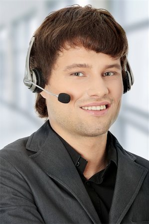 simsearch:400-03990860,k - Charming customer service representative with headset on Photographie de stock - Aubaine LD & Abonnement, Code: 400-04333682