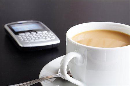 cup of coffee in the business office showing success Stock Photo - Budget Royalty-Free & Subscription, Code: 400-04333717