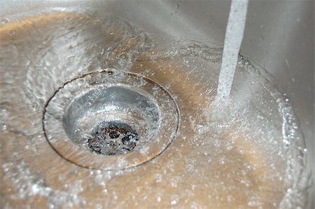 sink with bath bubbles - water flow into the drain in the kitchen Stock Photo - Budget Royalty-Free & Subscription, Code: 400-04333759