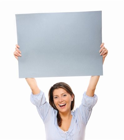 A portrait of a young happy woman holding a banner over white background Stock Photo - Budget Royalty-Free & Subscription, Code: 400-04333852