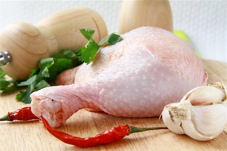 raw chicken on cutting board - raw chicken legs and spices on a cutting board Stock Photo - Budget Royalty-Free & Subscription, Code: 400-04344389