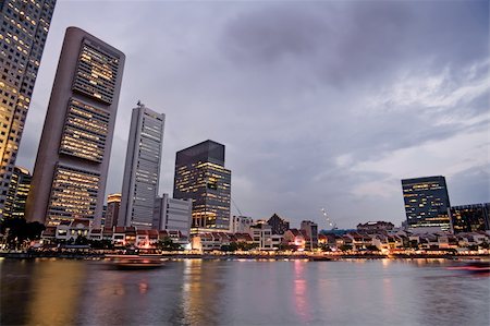 simsearch:400-06330815,k - Skyscrapers in the colorful sunset harbor in Singapore, asia. Foto de stock - Super Valor sin royalties y Suscripción, Código: 400-04344636