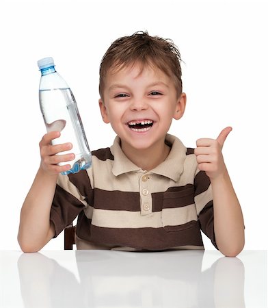 Portrait of a cute boy having a bottle of refreshing water - isolated on white Stock Photo - Budget Royalty-Free & Subscription, Code: 400-04344777