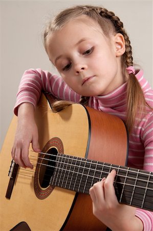 Young girl play classical guitar Stock Photo - Budget Royalty-Free & Subscription, Code: 400-04344924