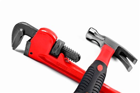 simsearch:400-04649780,k - Hammer and wrench on a white background with space for text Foto de stock - Super Valor sin royalties y Suscripción, Código: 400-04345143