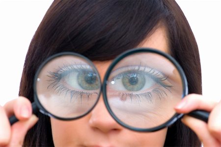 simsearch:400-04554899,k - Girl's eye magnified through magnified glass on white Stock Photo - Budget Royalty-Free & Subscription, Code: 400-04345407