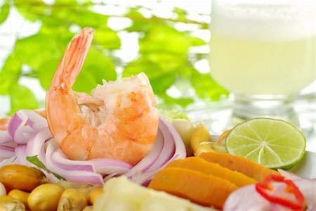 simsearch:400-04334388,k - Peruvian prawn ceviche with the cocktail pisco sour in the background (Selective Focus, Focus on the king prawn) Stock Photo - Budget Royalty-Free & Subscription, Code: 400-04345426