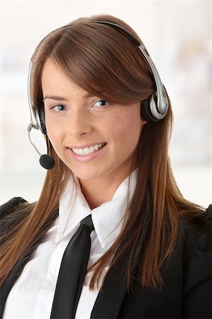 simsearch:400-03985399,k - Beautiful Call Center Woman Wearing A Telephone Headset Foto de stock - Royalty-Free Super Valor e Assinatura, Número: 400-04345457
