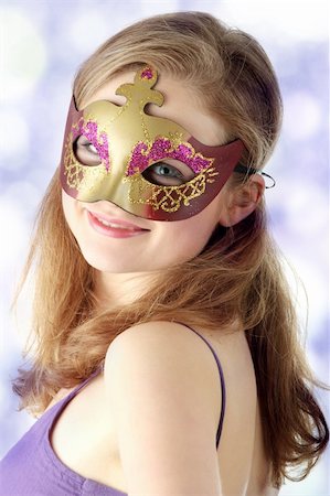 sensual in theater - Young beautiful woman in violet dress wearing carnival mask Stock Photo - Budget Royalty-Free & Subscription, Code: 400-04345474