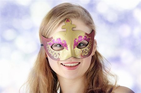 simsearch:400-04759494,k - Young beautiful woman in violet dress wearing carnival mask Stock Photo - Budget Royalty-Free & Subscription, Code: 400-04345475