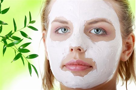 face and cleanse and one person - Cosmetics mask of clay on the  young female face, against abstract green background Stock Photo - Budget Royalty-Free & Subscription, Code: 400-04345525