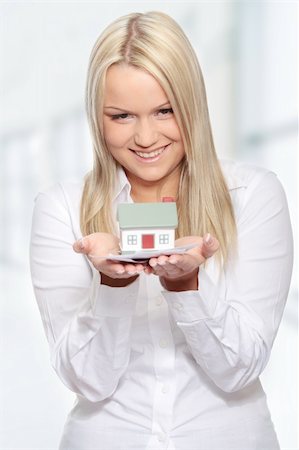 simsearch:400-06770104,k - Beautiful young woman holding euros bills and house model over white Foto de stock - Super Valor sin royalties y Suscripción, Código: 400-04345901