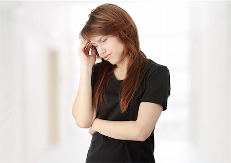Young woman having a headache Stock Photo - Budget Royalty-Free & Subscription, Code: 400-04346283