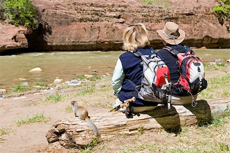 An active retired couple takes a rest to enjoy the view of the river Stock Photo - Budget Royalty-Free & Subscription, Code: 400-04346405