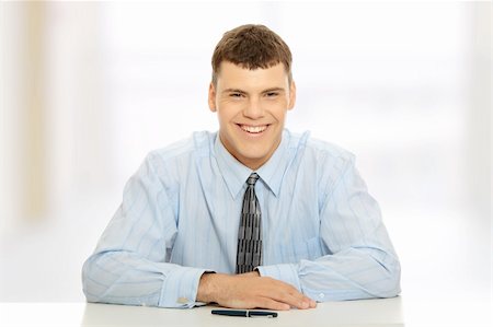 simsearch:400-05687698,k - Young businessman behind the desk Stock Photo - Budget Royalty-Free & Subscription, Code: 400-04346664