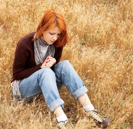 Lonely sad red-haired girl in field Stock Photo - Budget Royalty-Free & Subscription, Code: 400-04346849