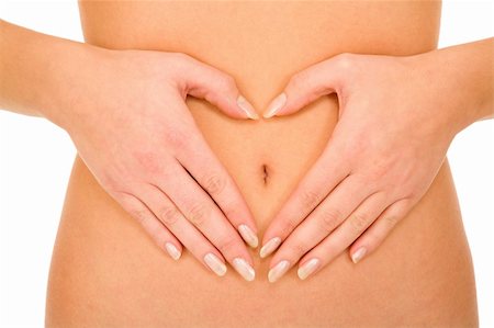 belly of a woman with hands around the navel Stock Photo - Budget Royalty-Free & Subscription, Code: 400-04346974