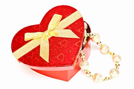 simsearch:400-06421347,k - Gift box with a golden heart in the form of Bantu. Stockbilder - Microstock & Abonnement, Bildnummer: 400-04347269