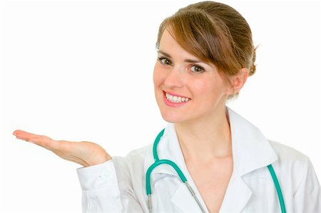 simsearch:400-04351236,k - Smiling medical doctor woman presenting something on empty hand isolated on white Stock Photo - Budget Royalty-Free & Subscription, Code: 400-04347286
