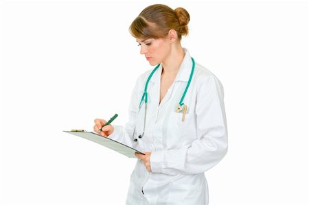 simsearch:400-07099882,k - Concentrated medical female doctor making notes in document isolated on white Photographie de stock - Aubaine LD & Abonnement, Code: 400-04347280