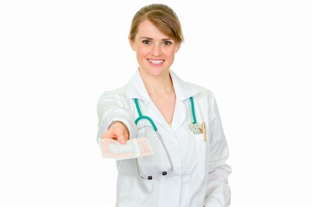 simsearch:400-07099882,k - Smiling medical female doctor holding medical prescription in hand isolated on white Photographie de stock - Aubaine LD & Abonnement, Code: 400-04347294