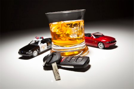 simsearch:400-04947548,k - Highway Patrol Police and Sports Car Next to Alcoholic Drink and Keys Under Spot Light. Stock Photo - Budget Royalty-Free & Subscription, Code: 400-04347427