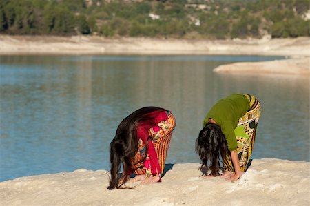 Mother and daugher at early morning yoga exercises Stock Photo - Budget Royalty-Free & Subscription, Code: 400-04347548