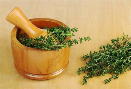 simsearch:400-04348087,k - Fresh thyme with wooden mortar and pestle on wooden board (Selective Focus) Stock Photo - Budget Royalty-Free & Subscription, Code: 400-04348087