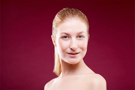 simsearch:400-04498992,k - Portrait of a young lady on red background Photographie de stock - Aubaine LD & Abonnement, Code: 400-04348452