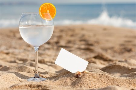 fresh drink on the sandyy coast with the message Stock Photo - Budget Royalty-Free & Subscription, Code: 400-04349340