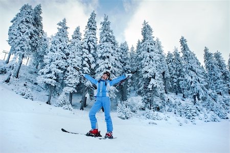 joy of skiing on snow-covered slopes among the firs in the forest Stock Photo - Budget Royalty-Free & Subscription, Code: 400-04349352