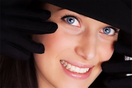 simsearch:400-05164576,k - Portrait of a beautiful brunette young woman with gloves and black hat Foto de stock - Royalty-Free Super Valor e Assinatura, Número: 400-04349858